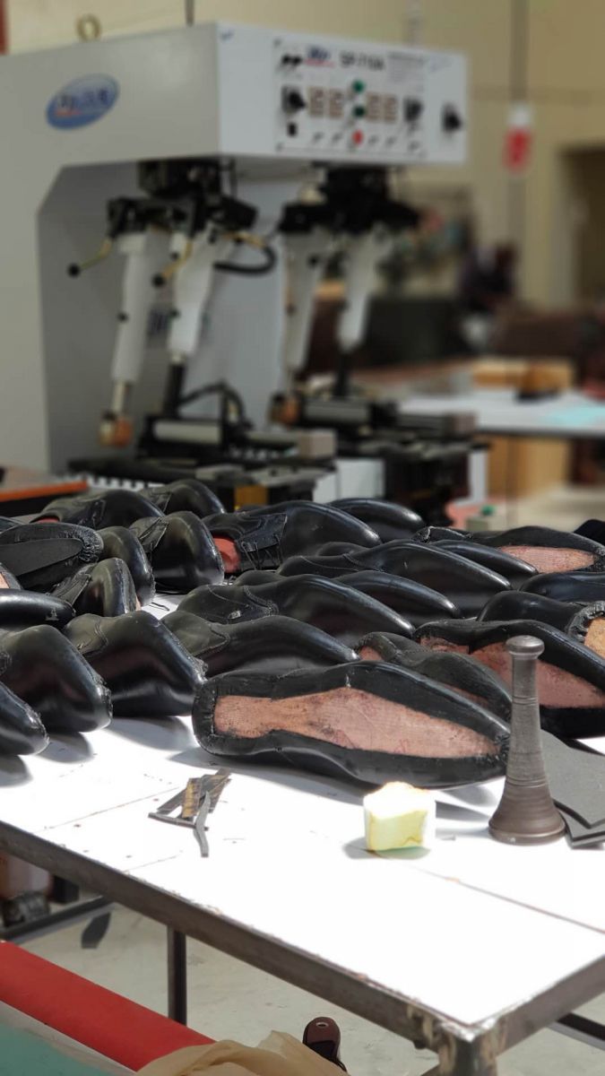 Finished lasted shoes with TS-710A walled sole attaching machine in Kenya factory
